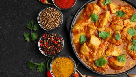indian curry served alongside curry powder, indian spice mix