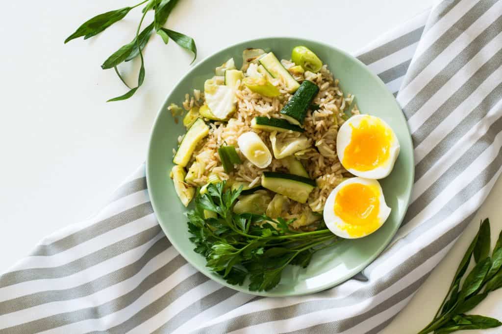 add greens and eggs to leftover rice for next day's meal