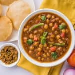 Chana Masala Served with Indian bread and condiments