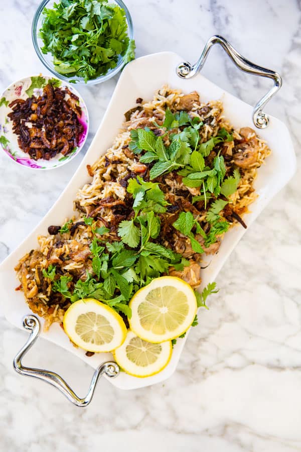 Instapot Chicken Biryani plated with garnish on top and the sides