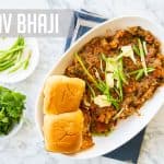 Pav Bhaji Served on a place with garnish of cilantro and Jalapenio